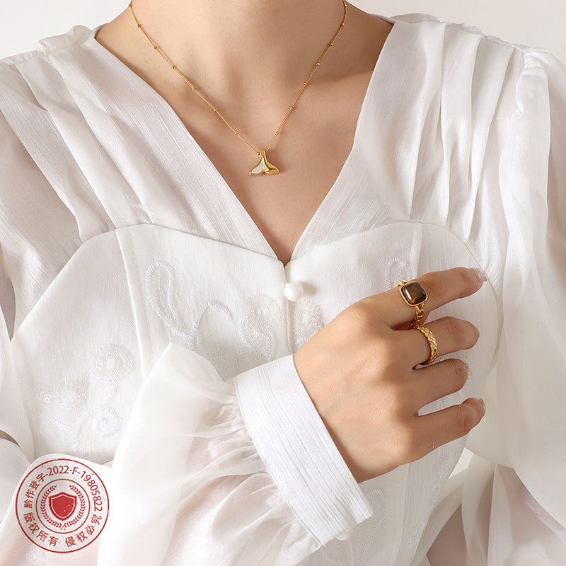 18K Gold PVD Mermaid Tail Necklace Worn on Model, 316L Stainless Steel White Mother-of-Pearl Whale Tail Pendant, Minimalist Everyday Wear Jewelry for Sensitive Skin, Wholesale Gold Necklace