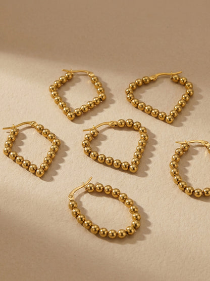 18K Gold PVD Twisted Hoop Earrings worn on ear, hypoallergenic stainless steel jewelry