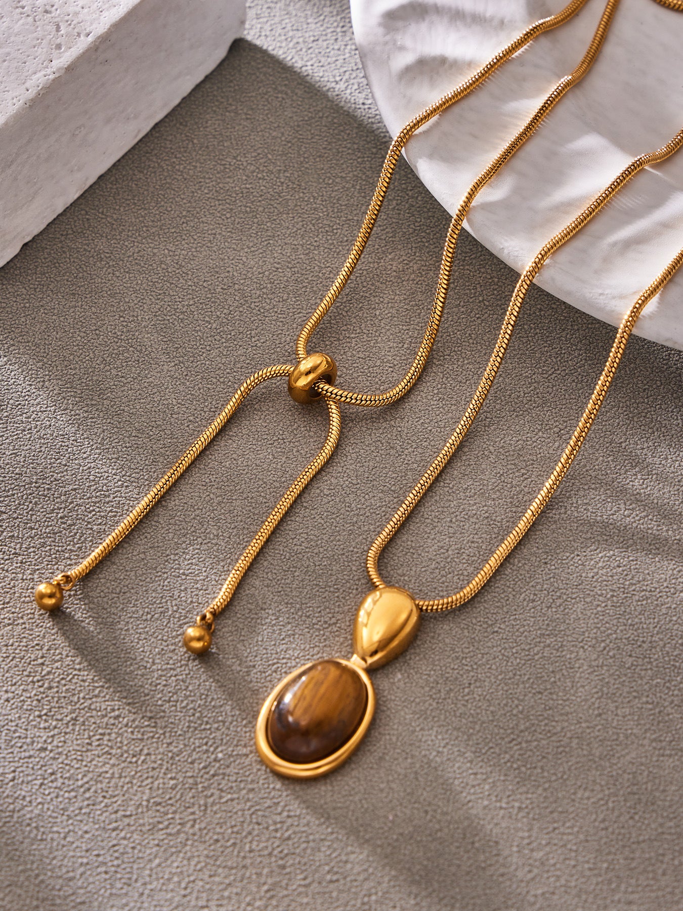 Steel Oval Stone Pendant Necklace worn on neck, minimalist stainless steel jewelry