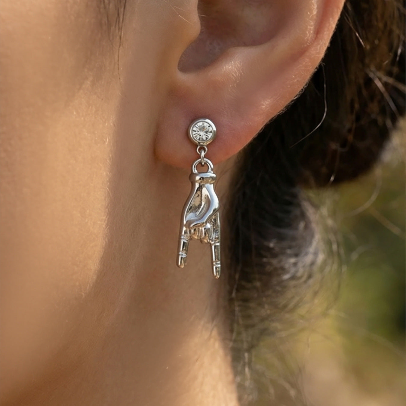 Steel Color Hand Gesture Zircon Dangle Earrings worn on ear, minimalist stainless steel jewelry