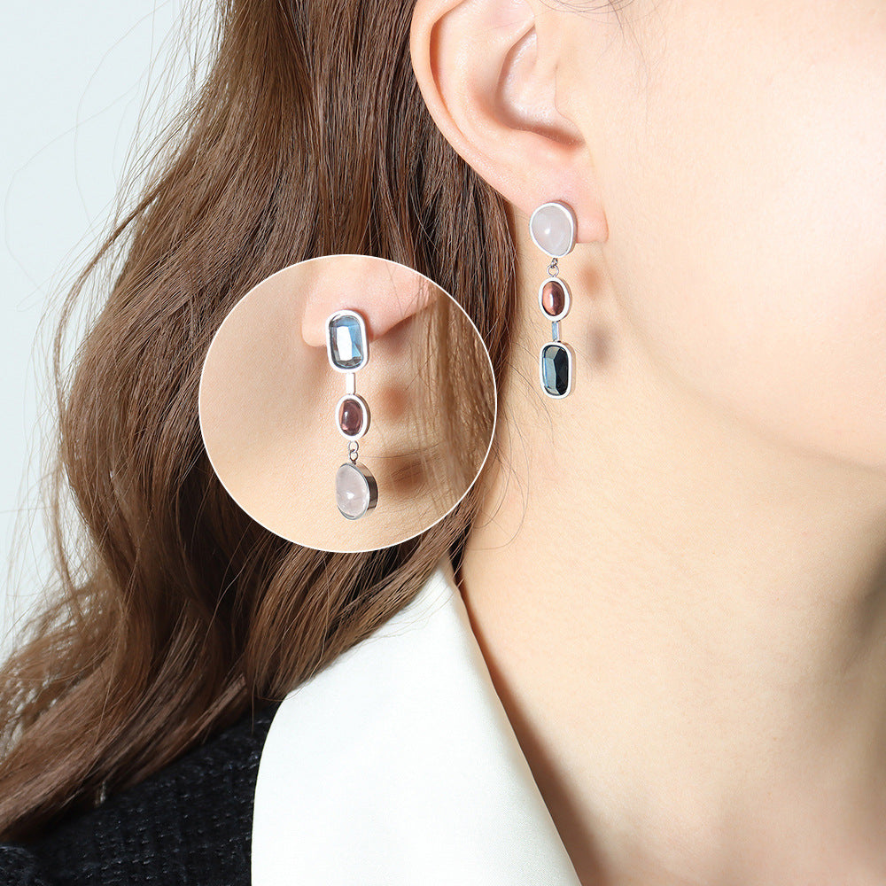 Asymmetrical Inlaid Gemstone Earrings worn on ear, European style stainless steel jewelry