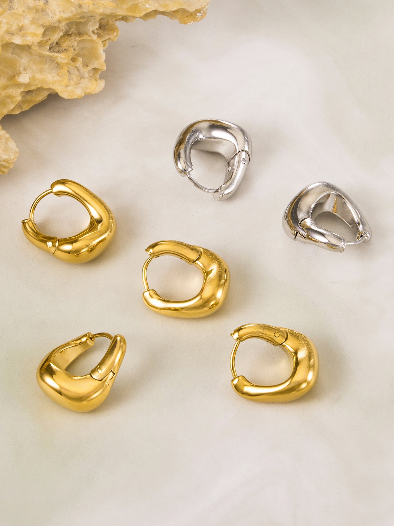 316L stainless steel 18K Gold PVD Oval Huggie Hoop Earrings boutique merchandising view for wholesale earrings buyers