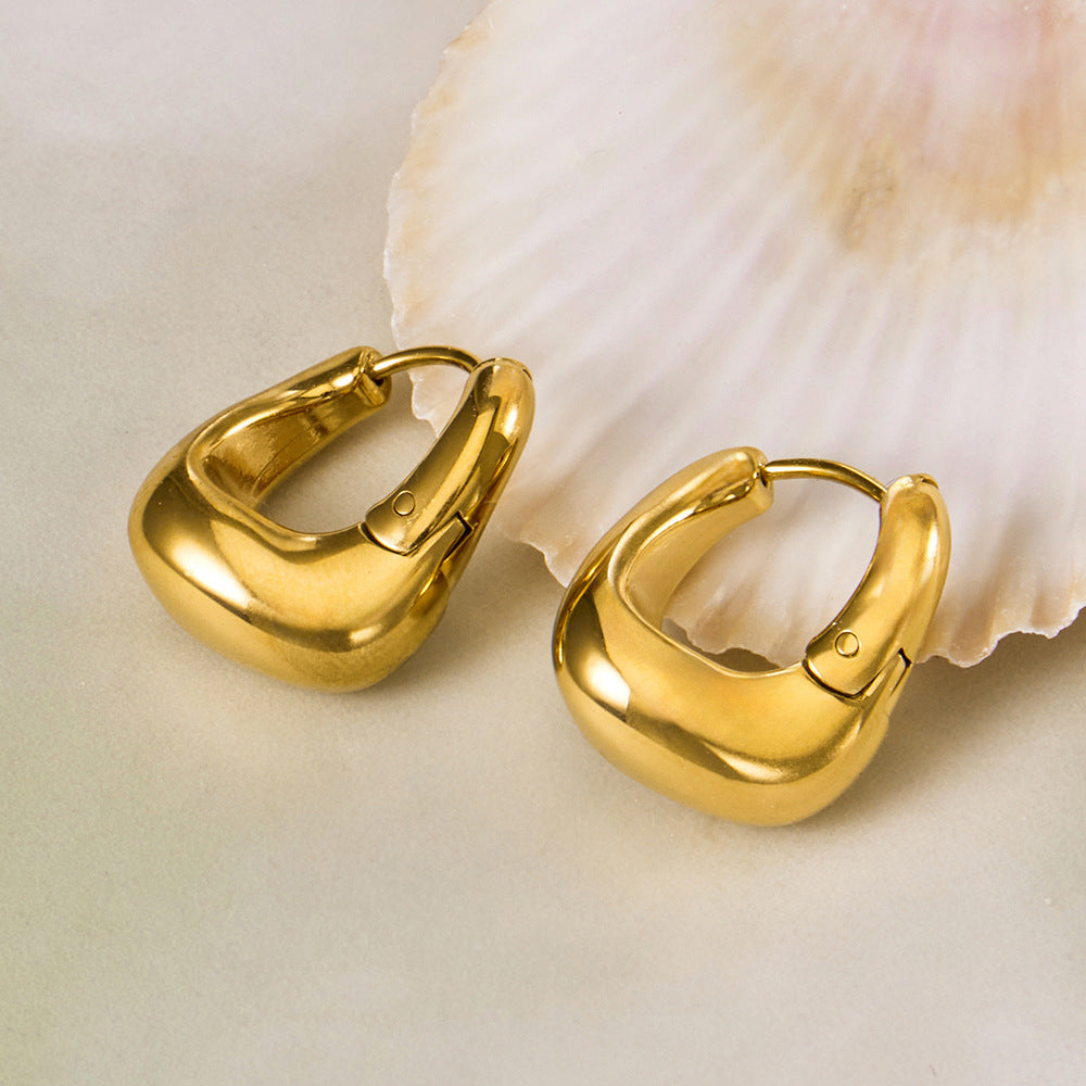 316L stainless steel 18K Gold PVD Oval Huggie Hoop Earrings flat lay display for wholesale earrings buyers