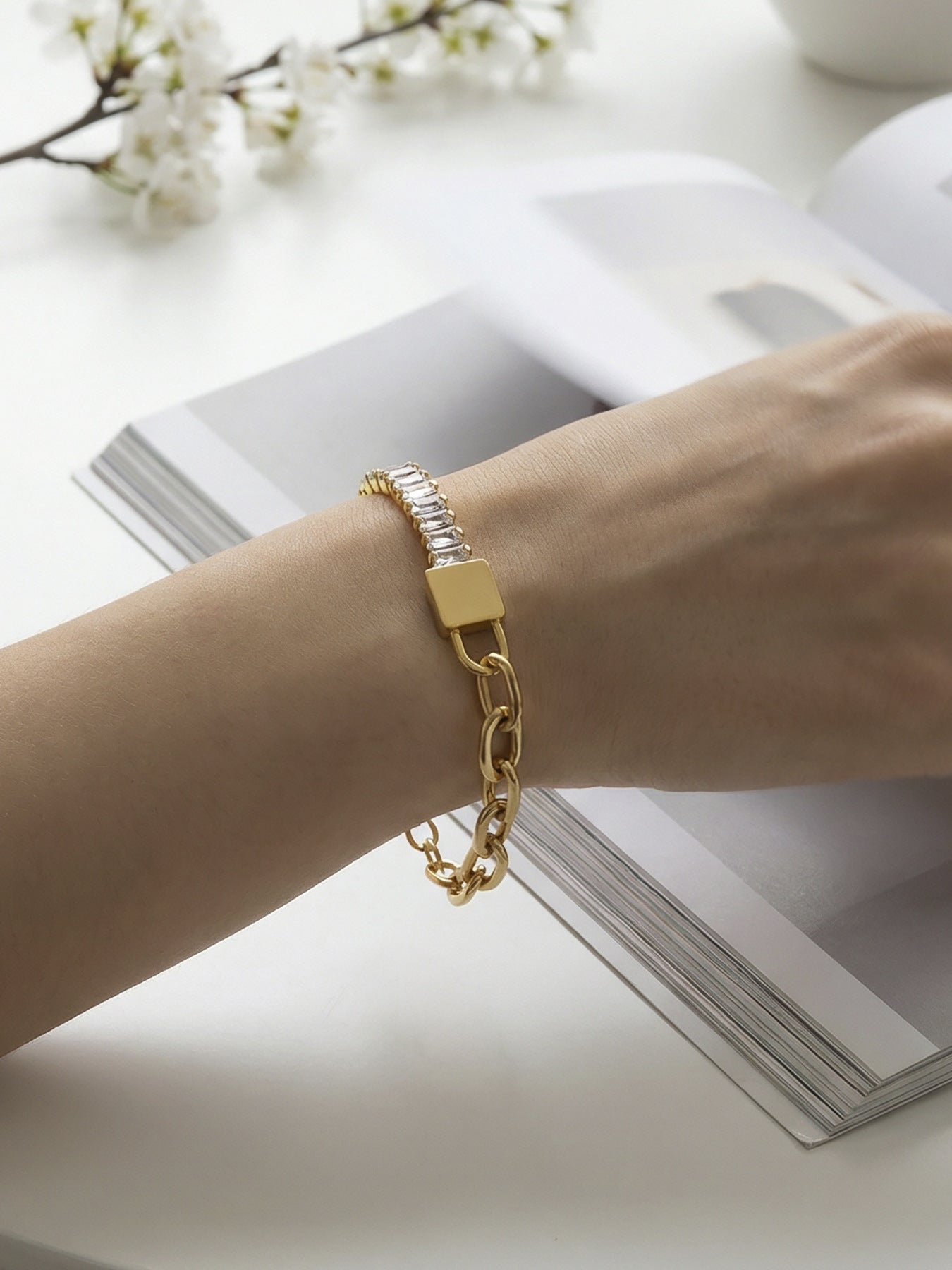 Close-up of 316L stainless steel 18K gold PVD 5A zircon lock link bracelet on wrist, gold finish, tarnish-free