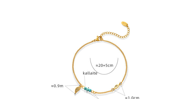 Gold turquoise wing anklet with adjustable clasp on white background, design details for wholesale minimalist product listing