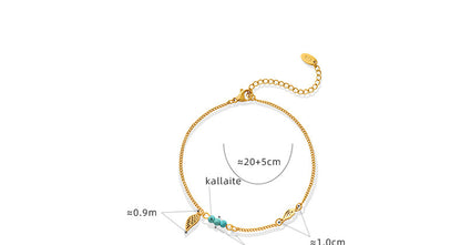 Gold turquoise wing anklet with adjustable clasp on white background, design details for wholesale minimalist product listing