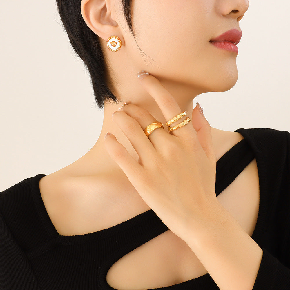 18K Gold PVD White Mother-of-Pearl Bee Drop Earrings Worn on Model, 316L Stainless Steel Hypoallergenic Bee Dangle Earrings, Everyday Wear Jewelry for Sensitive Skin, Wholesale Gold Earrings