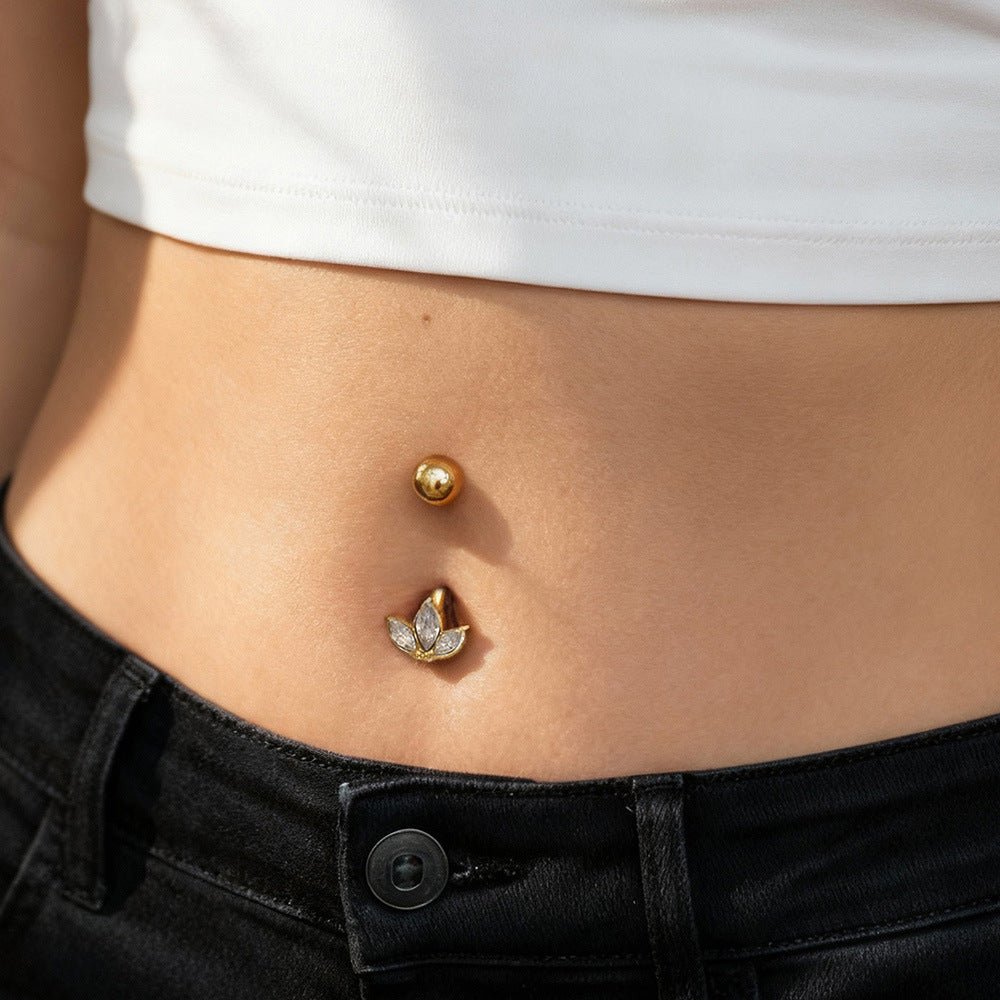 Gold CZ belly button ring worn on model navel, 18K PVD plated surgical steel body jewelry