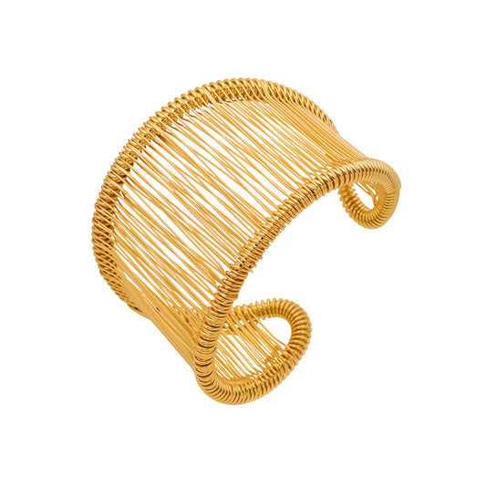 Wide wire cuff bracelet in 316L stainless steel with 18K PVD gold finish, modern open cuff bangle design on white background
