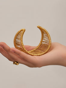 Gold wide wire cuff bracelet made of 316L stainless steel displayed on hand, lightweight open bangle for modern fashion styling
