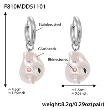 Product specifications and length of the silver steel color hypoallergenic baroque pearl earrings.