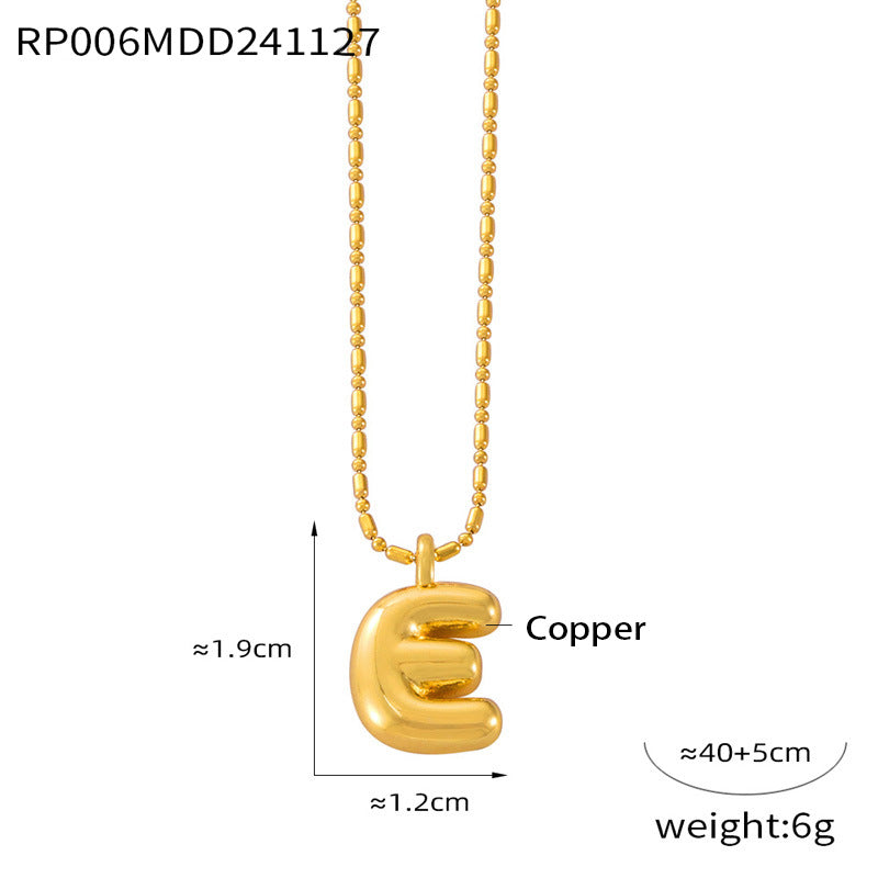 Close-up of balloon letter pendant necklace