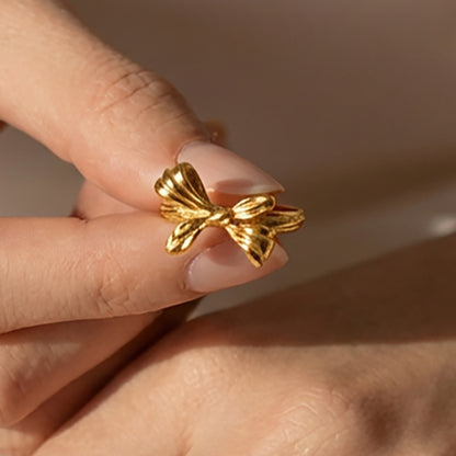 316L stainless steel bow open ring with 18K gold PVD finish worn on finger