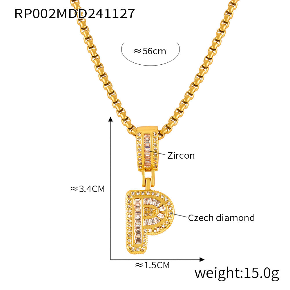 Close-up of 316L stainless steel letter pendant with gold finish