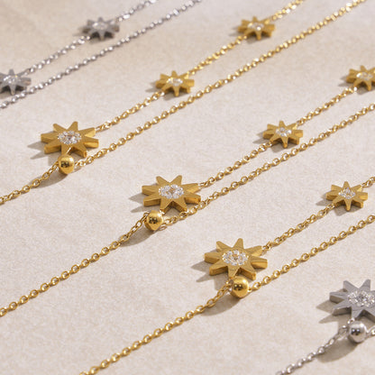 Close-up of 316L stainless steel celestial star tassel necklace with zircon, gold and silver waterproof jewelry