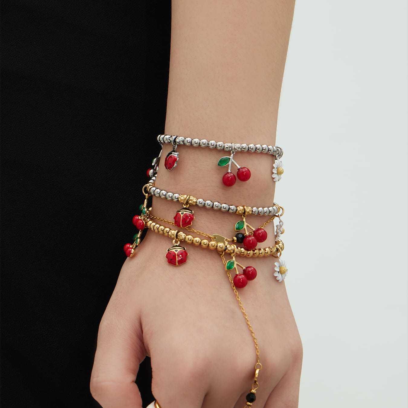 316L stainless steel cherry daisy charm bracelet stacked on wrist wholesale styling