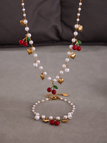 Colorful beaded necklaces with heart and cherry charms displayed on a clean background for wholesale selection.