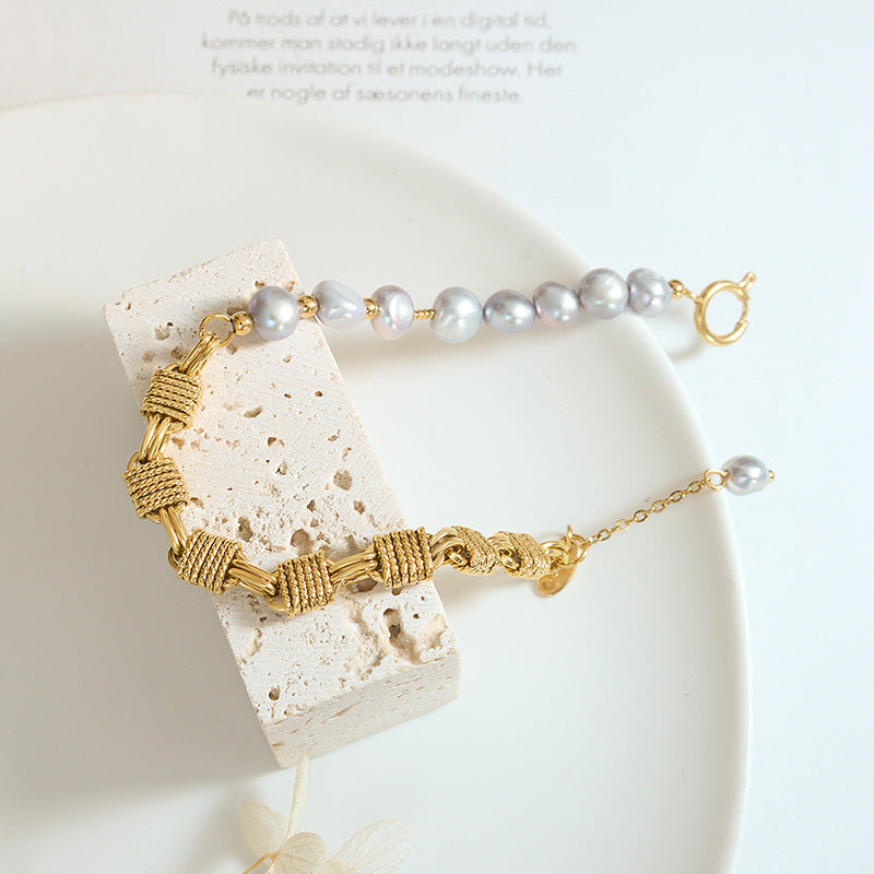 Dainty grey freshwater pearl bracelet styled on wrist for soft feminine boutique jewelry collections