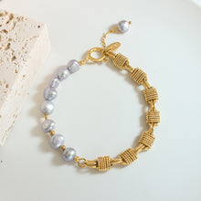 Grey freshwater pearl bracelet flat lay with gold plated copper details for wholesale bracelet assortments