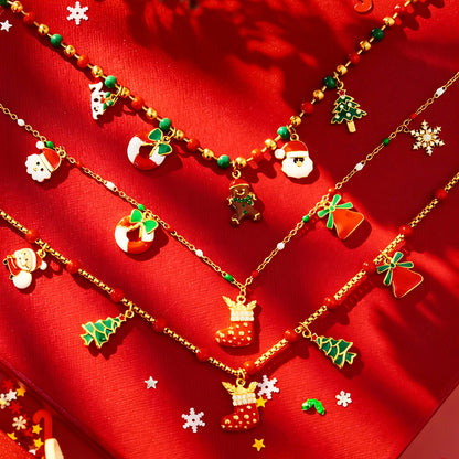 316L stainless steel Christmas beaded charm necklace flat lay with enamel Santa and stocking charms