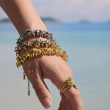 Chunky heart charm bracelets in gold, two-tone, and steel options for wholesale jewelry displays