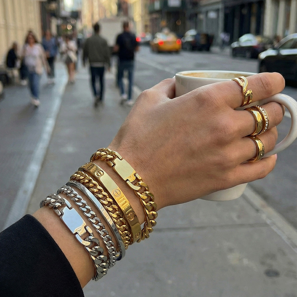316L Stainless Steel chunky Cuban chain bracelet on model, 18K gold PVD finish, bold statement style