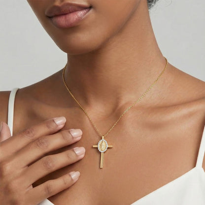 Gold plated 316L stainless steel cross necklace worn on model hand