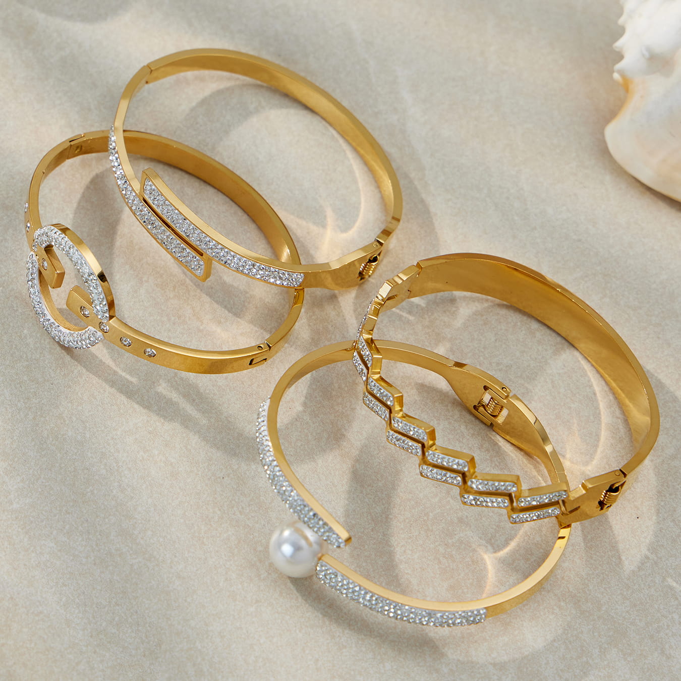 316L stainless steel CZ geometric bangle bracelet set in 18K PVD gold, wholesale flat lay