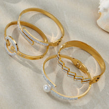 316L stainless steel CZ geometric bangle bracelet set in 18K PVD gold, wholesale flat lay