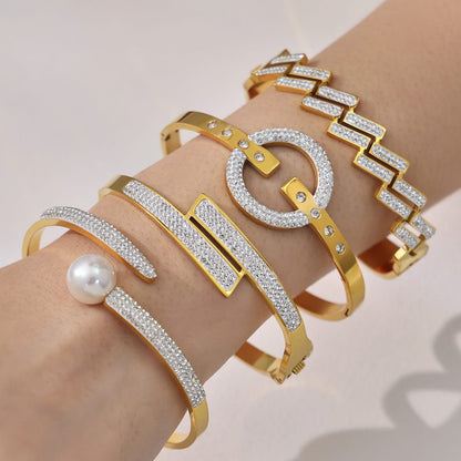 316L stainless steel CZ bangle bracelet set layered on wrist in 18K PVD gold for wholesale