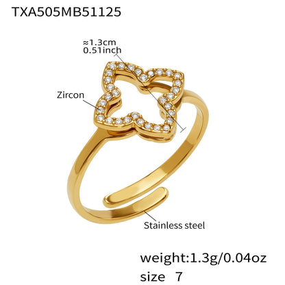 Close up detail of 316L stainless steel CZ clover open ring with gold plating
