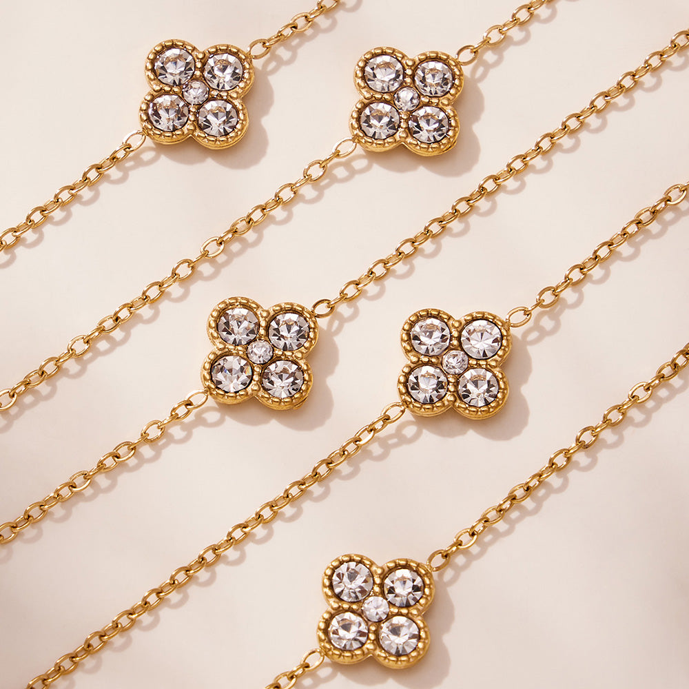 Close-up detail of CZ flower station on 316L stainless steel gold necklace