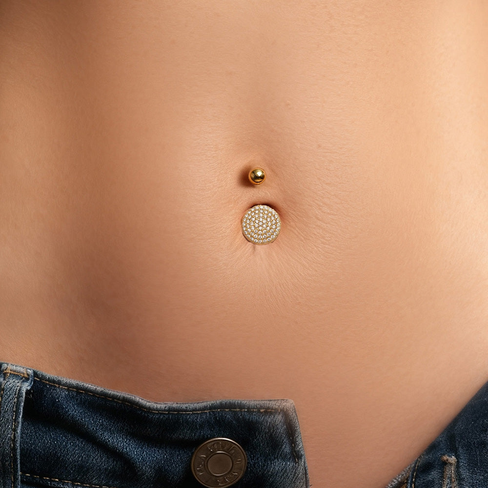 Gold CZ heart belly button ring on model navel, stylish surgical steel navel piercing jewelry for women