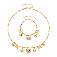 A complete 316L stainless steel dog zircon pave bone multi-pendant jewelry set in 18K gold plating, featuring necklaces and bracelets.