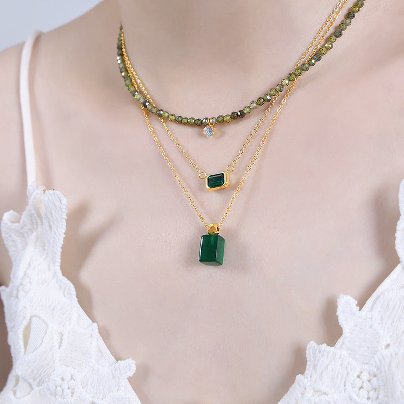 316L stainless steel Elegant Green Crystal Inlaid Minimalist Necklace flat lay display for wholesale necklace buyers