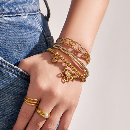 316L Stainless Steel 18K PVD Gold Flower Heart Zircon Bangle made with 316L stainless steel and 18K PVD gold finish for wholesale jewelry buyers - image 11