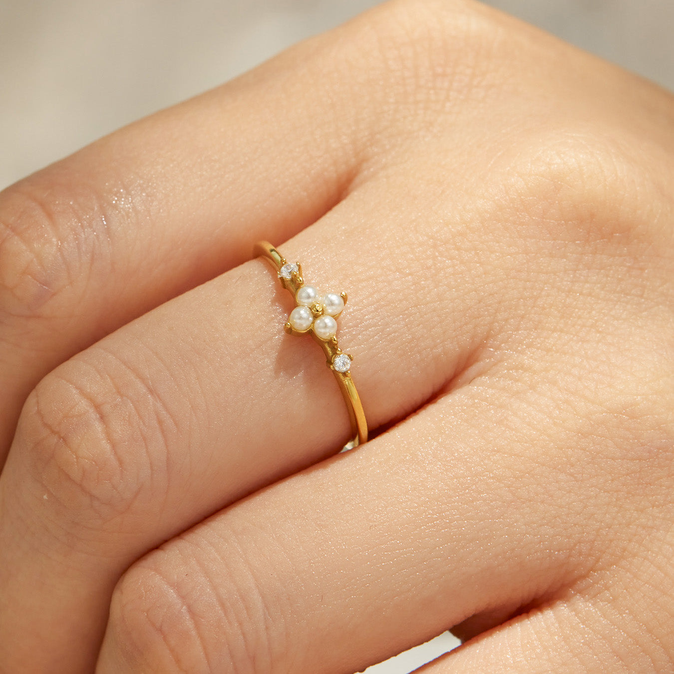 Chic pearl gold ring in display