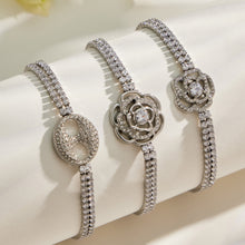 Three steel finish white zircon bracelets with decorative centerpiece designs