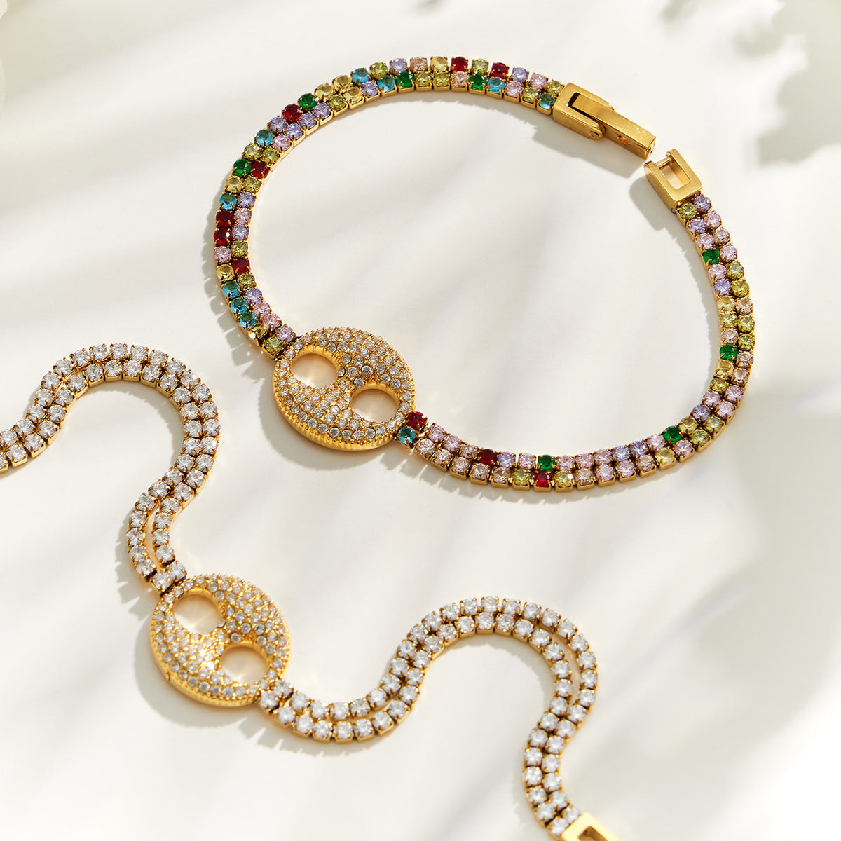 Double-ring zircon bracelets in multicolor and white stone versions with gold finish