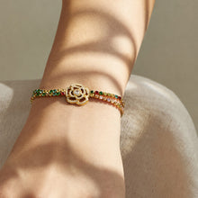 Multicolor flower zircon bracelet in gold finish worn on the wrist