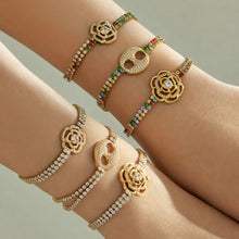 Gold multicolor and steel white zircon bracelet styles layered across both wrists
