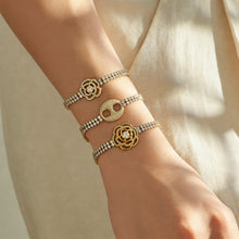 White zircon bracelets in steel finish with three decorative center motifs worn together
