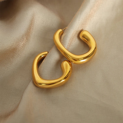 Polished 316L stainless steel gold hoop earrings with modern geometric curve design
