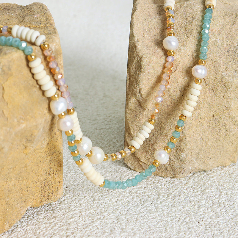 Close-up detail of 316L stainless steel glass stone and pearl beaded necklace
