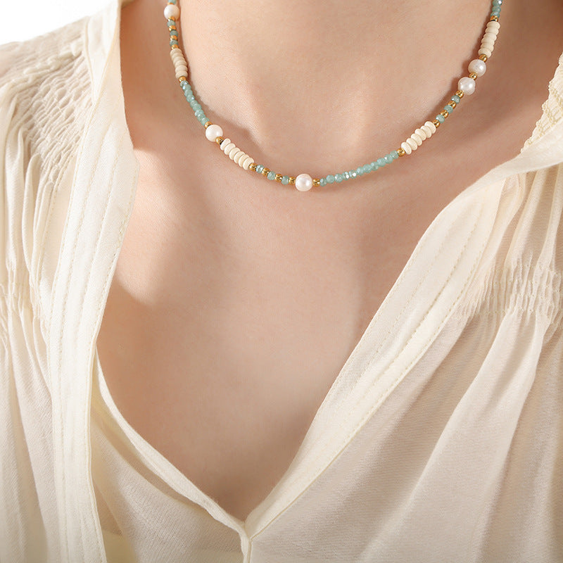 316L stainless steel glass and pearl beaded necklace worn on model, elegant wholesale jewelry design