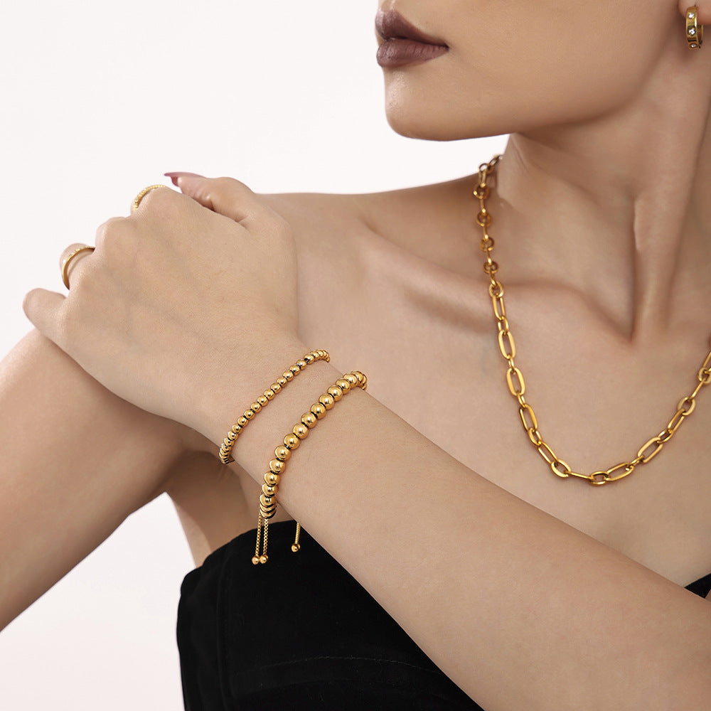 Adjustable gold bead bracelet in 316L stainless steel designed for stacking wear