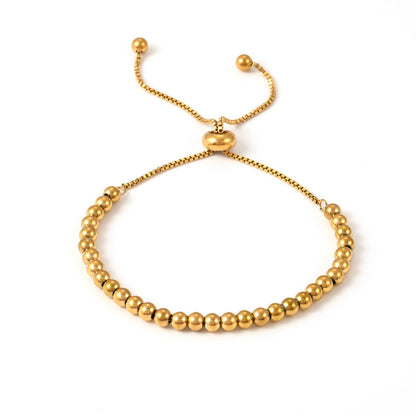 Minimalist gold bead slider bracelet crafted from 316L stainless steel with adjustable fit