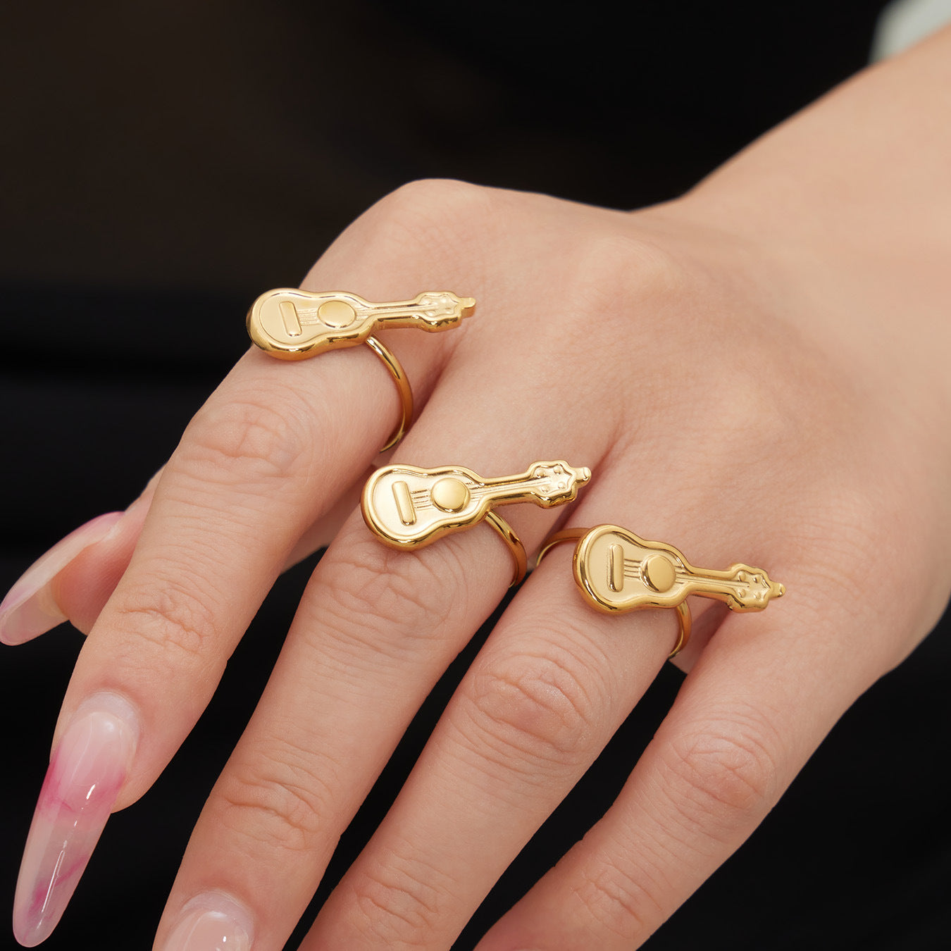 Close-up of 18K gold plated 316L stainless steel guitar adjustable ring on hand