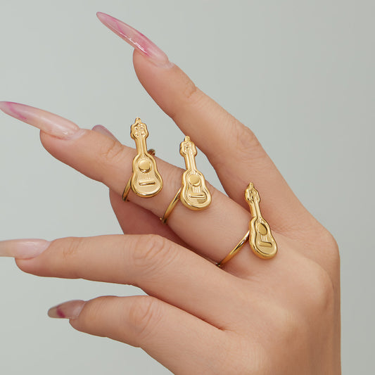 Model wearing stackable 316L stainless steel guitar adjustable rings in gold finish