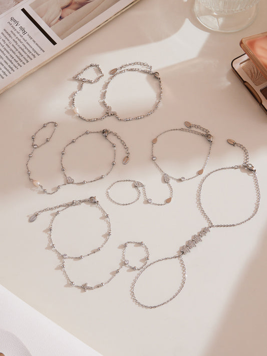 Gold hand chain bracelet with zircon embellishments